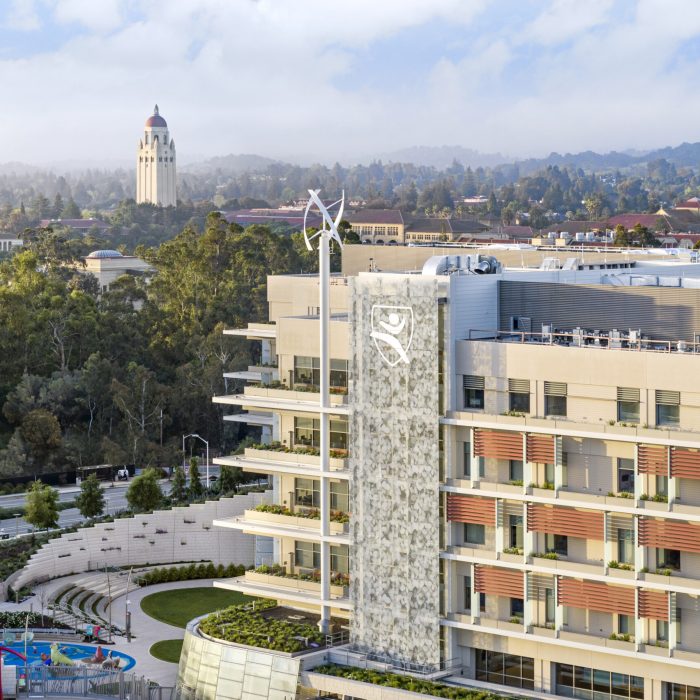 Photo of exterior of Lucile Packard Children's Hospital Stanford and the Hoover Tower on the Stanford campus.
